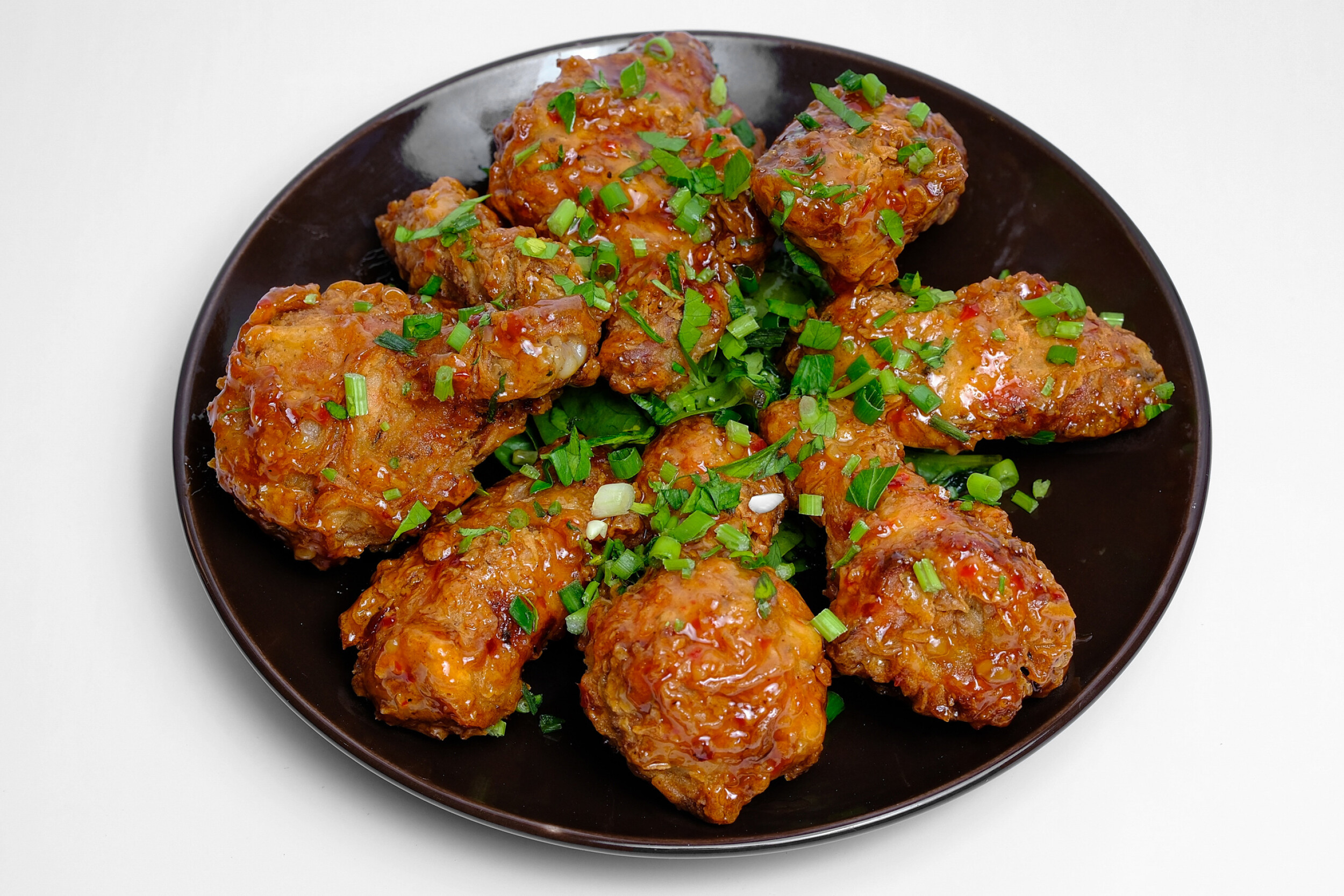 Sweet Chilli Crispy Chicken - Crispy fried chicken breast with sweet chilli sauce, lettuce, and mayo on a brioche bun